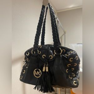 Gently used black leather with gold accent . 11.5x8 in